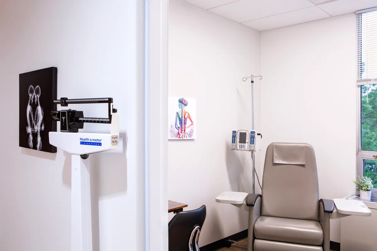 A private infusion room with a comfortable recliner and infusion equipment