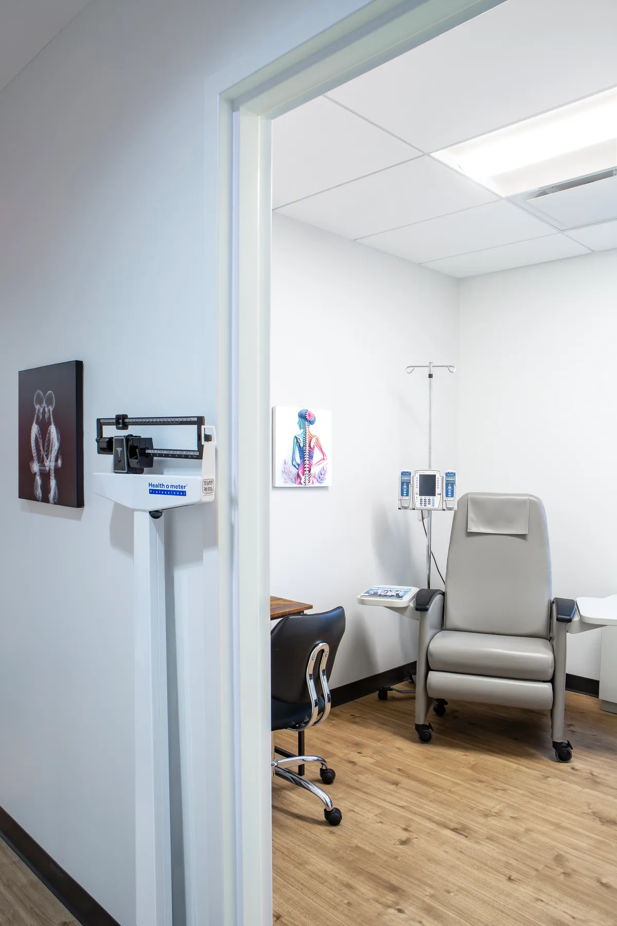 A private infusion room with a reclining treatment chair